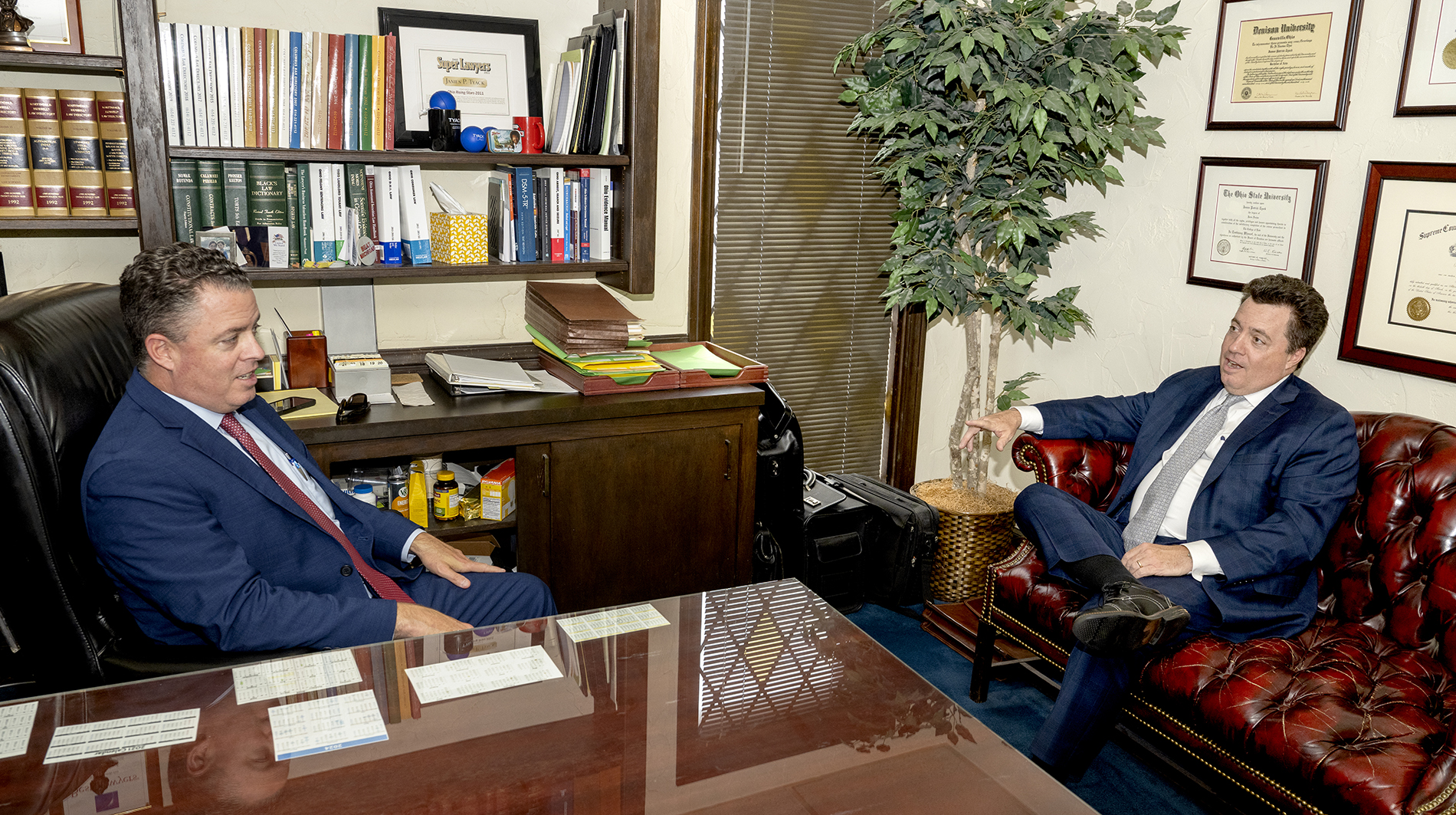 attorney-brothers-discussion Two Attorney brothers having a discussion in office