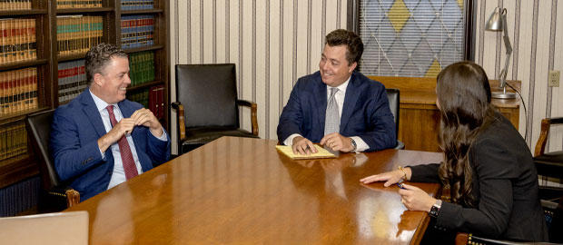 Tyack Lawyers have a conversation around the conference table